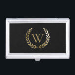 Elegantes Black Laurel Wreath Monogramm Visitenkarten Dose<br><div class="desc">Dieses elegante Visitenkartengehäuse mit Ihrem Monogramm in Imitat Gold,  gerahmt durch einen passenden goldenen Lorbeerkranz auf schwarzem Hintergrund. Entworfen von Susan Coffey.</div>