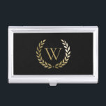 Elegantes Black Laurel Wreath Monogramm Visitenkarten Dose<br><div class="desc">Dieses elegante Visitenkartengehäuse mit Ihrem Monogramm in Imitat Gold,  gerahmt durch einen passenden goldenen Lorbeerkranz auf schwarzem Hintergrund. Entworfen von Susan Coffey.</div>