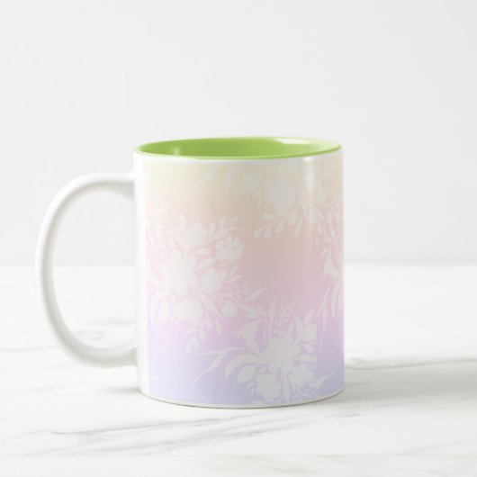 Elegantes Blumenmuster in Pastellfarben Zweifarbige Tasse (Links)