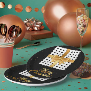 Elegantes Geschenk mit goldenen Schleifen und Polk Pappteller