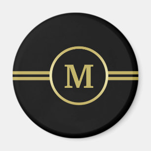 Elegantes Goldmonogramm auf schwarzem Magnet