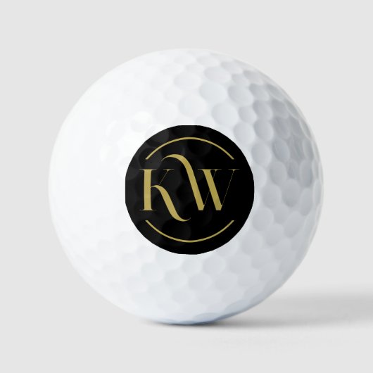 Elegantes Schwarz-Gold Monogramm Golfball (Vorderseite)