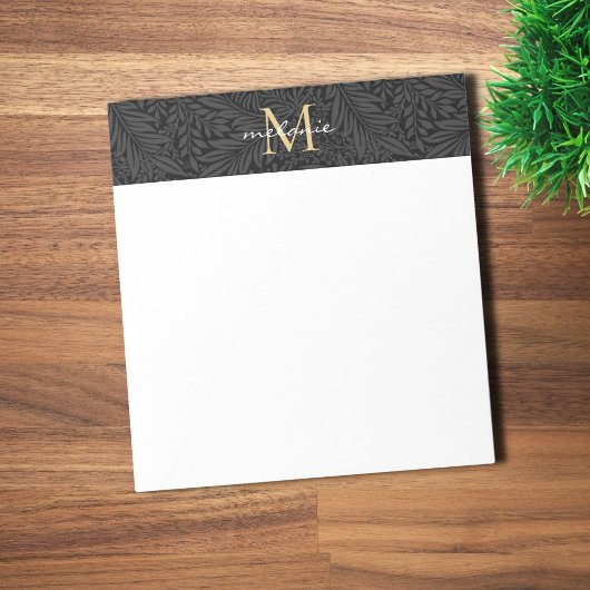 Elegantes schwarzes goldenes florales Schriftmonog Notizblock