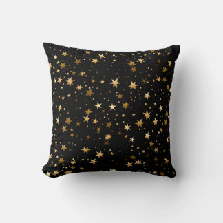 Elegantes, schwarzes Kissen mit goldenen Sternen