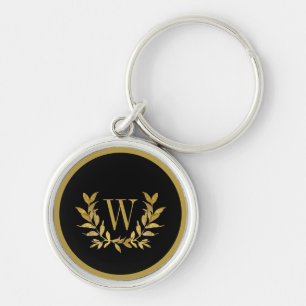 Elegantes schwarzes, modernes Monogramm mit golden Schlüsselanhänger