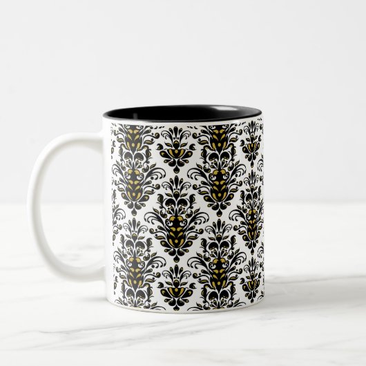 Elegantes Schwarzweiss mit Touch des Golddamastes Zweifarbige Tasse (Links)