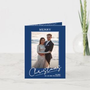 Elegantes Weihnachtsgruß-Script auf blauem gefalte Feiertagskarte