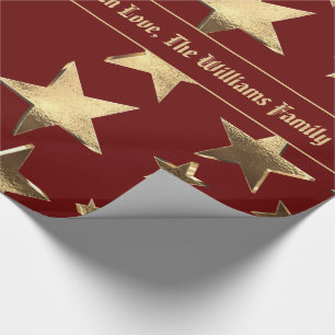 Elegantes Weihnachtsmuster aus Rot- und Goldstar Geschenkpapier