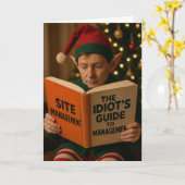 Elf liest 'Idiot's Guide to Site Management' Karte (Gelbe Blume)