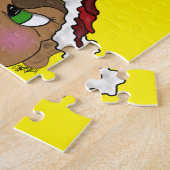 Elf mit einer Weihnachtsmannmütze aus einem Roten  Puzzle (Seite)
