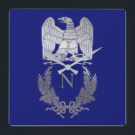 Emblem von Napoleon Bonaparte Quadratische Wanduhr<br><div class="desc">Französische Kaiseradler (Aigle de drapeau,  beleuchtet. "Fahnenadler") bezieht sich auf die Figur eines Adlers,  der von der Grande Armée von Napoleon I während der Napoleonischen Kriege als Standard in den Kampf geführt wurde.</div>