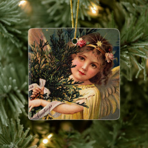 Engel mit einem Armvoll Weihnachtsgrün Keramikornament