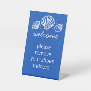 Entfernen Sie Schuhe Muscheln Strand Ferienvermiet Sockelschild