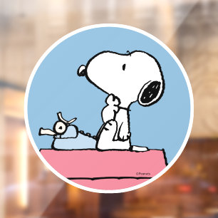Erdnüsse Snoopy bei der Schreibmaschine Fensteraufkleber