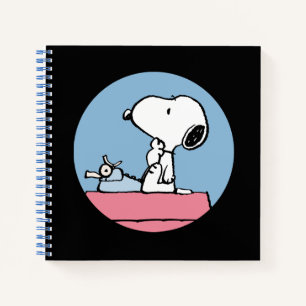 Erdnüsse Snoopy bei der Schreibmaschine Notizblock