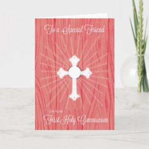 Erstkommunionkreuz und Strahlen auf rosa Holz Karte