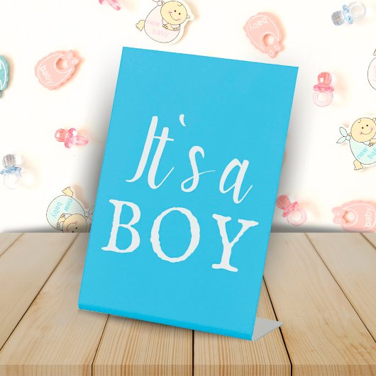 Es ist ein Baby Blue Typografy Baby Shower Sockelschild