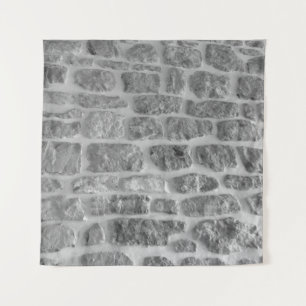Es ist ein grobes, horizontal gezogenes Mauermuste Wandteppich