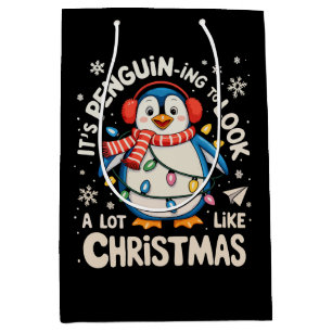 Es ist Pinguin-Ing, so auszusehen wie Weihnachtsna Mittlere Geschenktüte