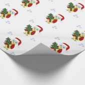 Eule in einer Weihnachtsmannmütze mit einem Weihna Geschenkpapier (Ecke)