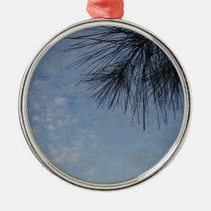 Evergreen Pine Against Snowy Blue Sky Silbernes Ornament
