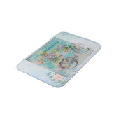 Fahrrad mit Blume-Körben auf blauem Schoß Badematte (Schrägansicht)