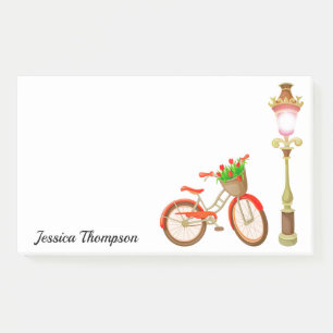 Fahrrad mit Körbchen von Blume nach der Eingabe Post-it Klebezettel