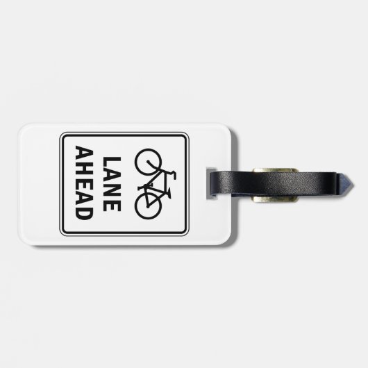 Fahrradbahn vor dem Schild Straßenverkehrssicherhe Gepäckanhänger (Rückseite horizontal)