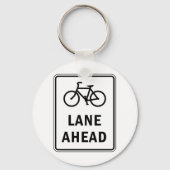 Fahrradbahn vor dem Schild Straßenverkehrssicherhe Schlüsselanhänger (Rückseite)