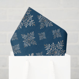 Falsche graue Folien-Schneeflocken auf Blau (keine Seidenpapier