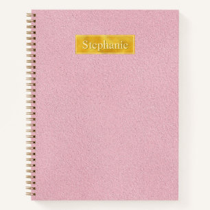 Falsche rosa Ledertextur mit Goldfolienbanner Notizblock