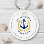 Family Name Beach House Anchor Gold Laurel Star Schlüsselanhänger<br><div class="desc">A stylish nautical style metal keychain with your personalized family name and beach house, lake house, or other desired text and established date. Features a custom designed boat anchor with gold style laurel leaves and a star on white or easily customize the base color to match your current decor or...</div>