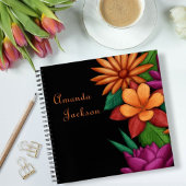 Farbenfrohe blühende Blume Typografie Notizblock