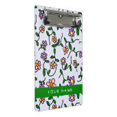 Farbenfrohe Blume, blauer Hintergrund, grün Mini Klemmbrett (Schrägansicht)