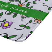 Farbenfrohe Blume, blauer Hintergrund, grün Schneidebrett (Ecke)