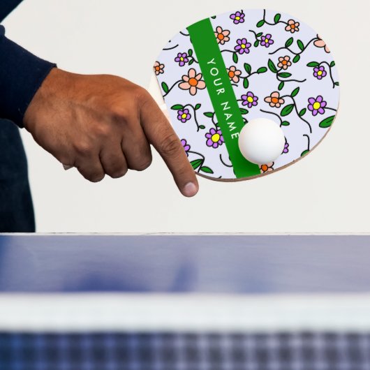 Farbenfrohe Blume, blauer Hintergrund, grün Tischtennis Schläger (InSitu)