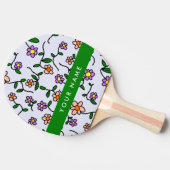 Farbenfrohe Blume, blauer Hintergrund, grün Tischtennis Schläger (Seitenansicht)