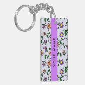 Farbenfrohe Blume, blauer Hintergrund, Lila Schlüsselanhänger (Vorderseite links)