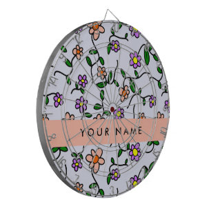 Farbenfrohe Blume, blauer Hintergrund, orange Dartscheibe