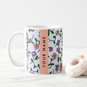 Farbenfrohe Blume, blauer Hintergrund, orange Kaffeetasse