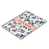 Farbenfrohe Blume, blauer Hintergrund, orange Notizblock (Linke Seite)