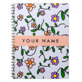 Farbenfrohe Blume, blauer Hintergrund, orange Notizblock (Vorderseite)