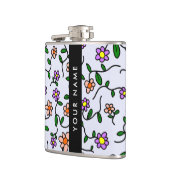 Farbenfrohe Blume, blauer Hintergrund, schwarz Flachmann (Links)