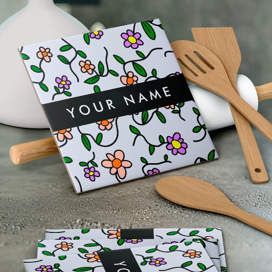 Farbenfrohe Blume, blauer Hintergrund, schwarz Fliese