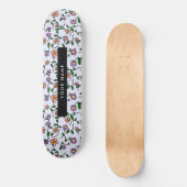 Farbenfrohe Blume, blauer Hintergrund, schwarz Skateboard (Vorderseite)