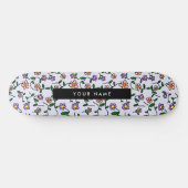 Farbenfrohe Blume, blauer Hintergrund, schwarz Skateboard (Horizontal)