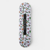 Farbenfrohe Blume, blauer Hintergrund, schwarz Skateboard (Vorderseite)