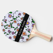 Farbenfrohe Blume, blauer Hintergrund, schwarz Tischtennis Schläger (Seitenansicht)