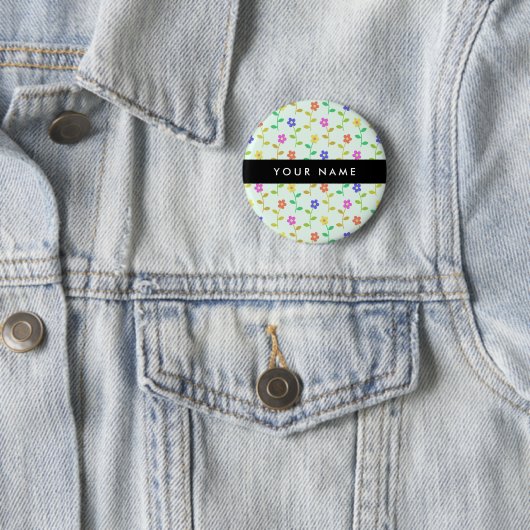 Farbenfrohe Blume, hellgrüner Hintergrund, schwarz Button (Beispiel)
