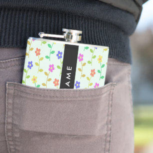 Farbenfrohe Blume, hellgrüner Hintergrund, schwarz Flachmann